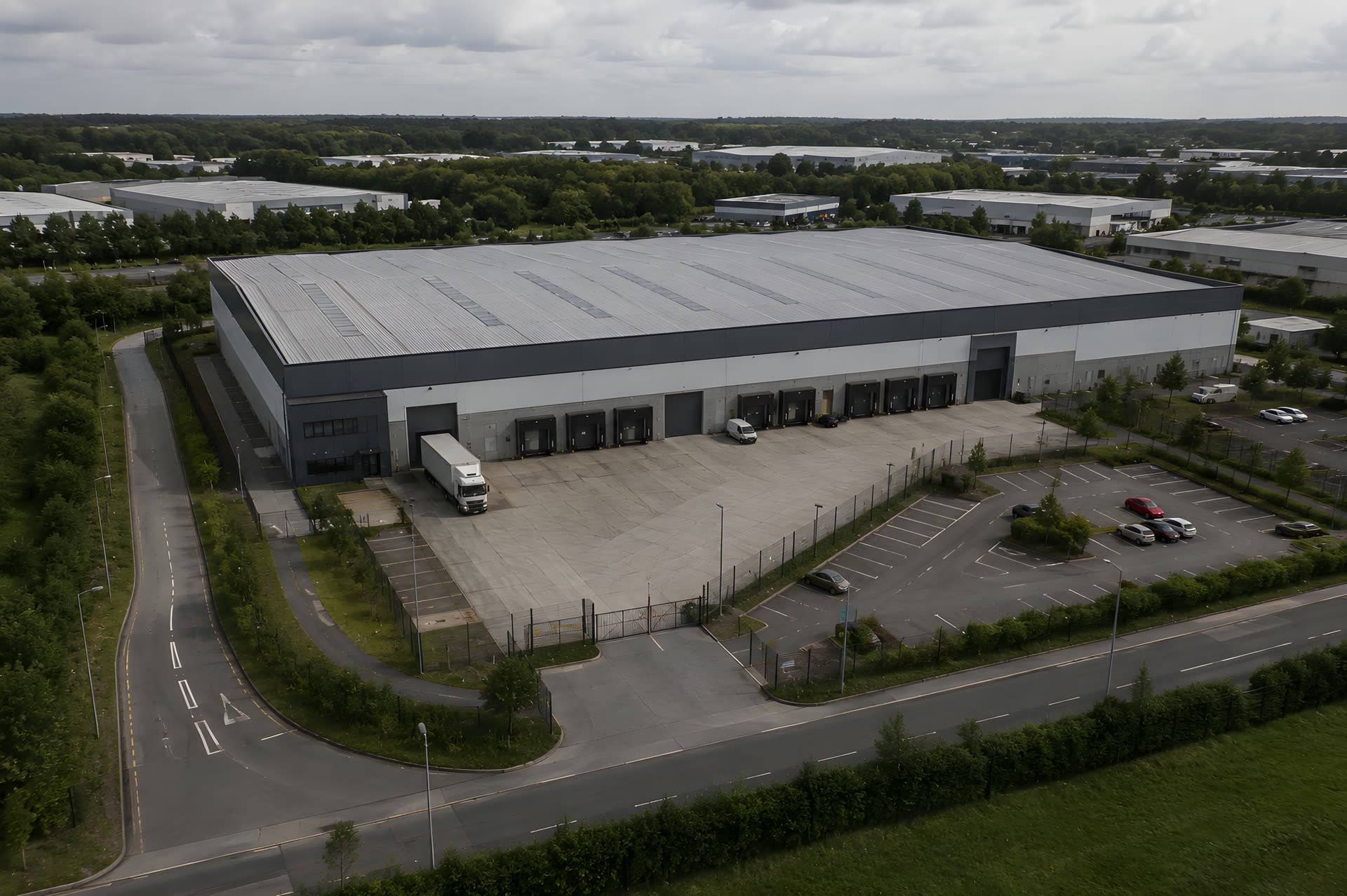 Aerial view of a commercial warehouse with its loading bays and yard